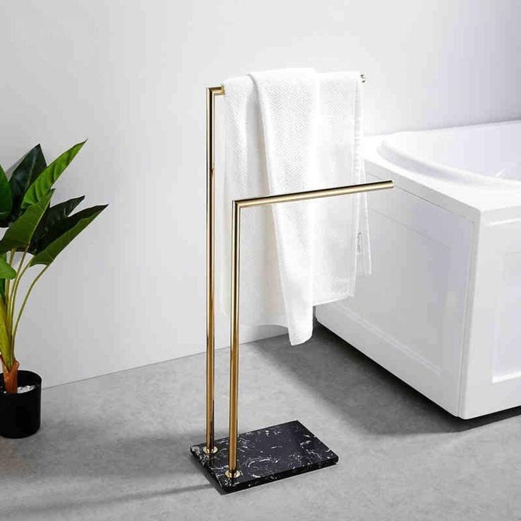 Double Bar Towel Stand en métal doré avec base en marbre